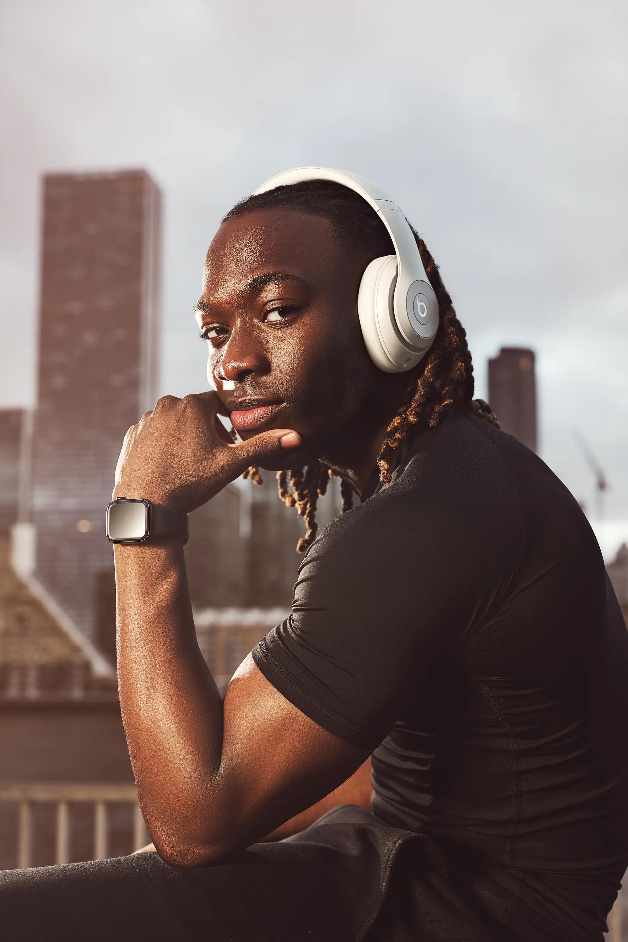 male athlete wearing headphones city skyline London lifestyle photography