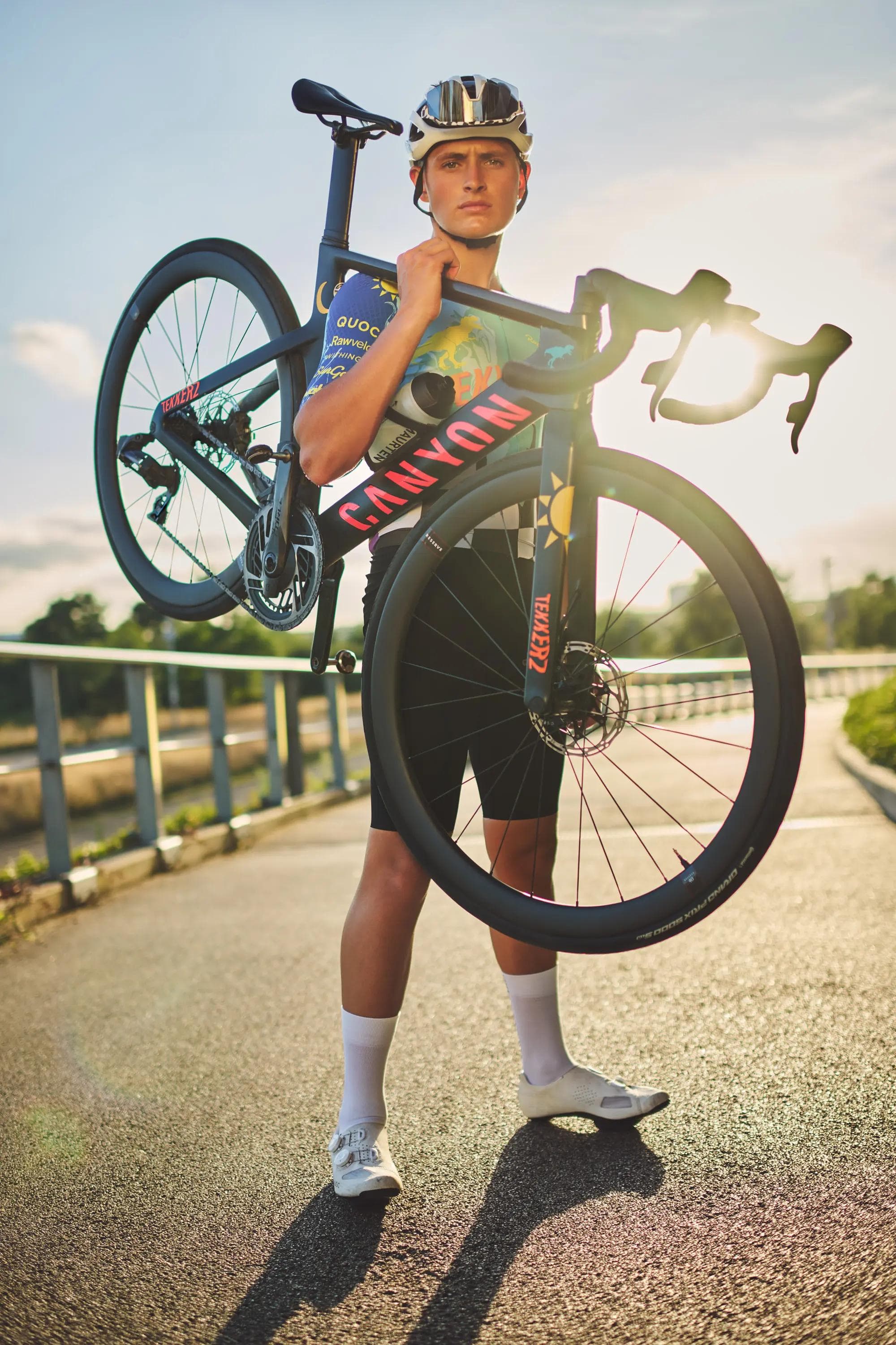 close up cyclist adjusting sunglasses and helmet, focused expression, sports portrait photography London
