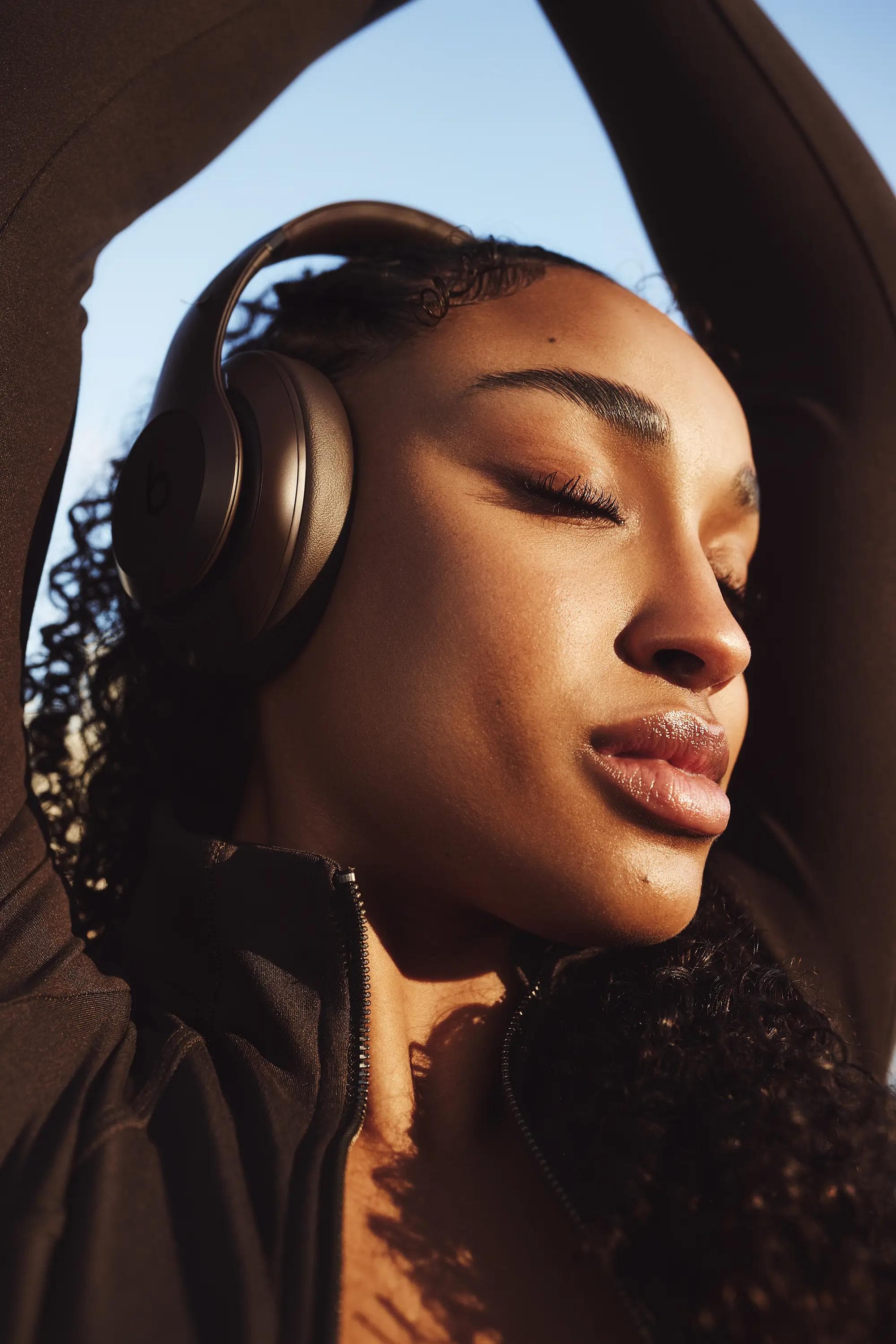 woman wearing headphones city background golden hour London lifestyle photography