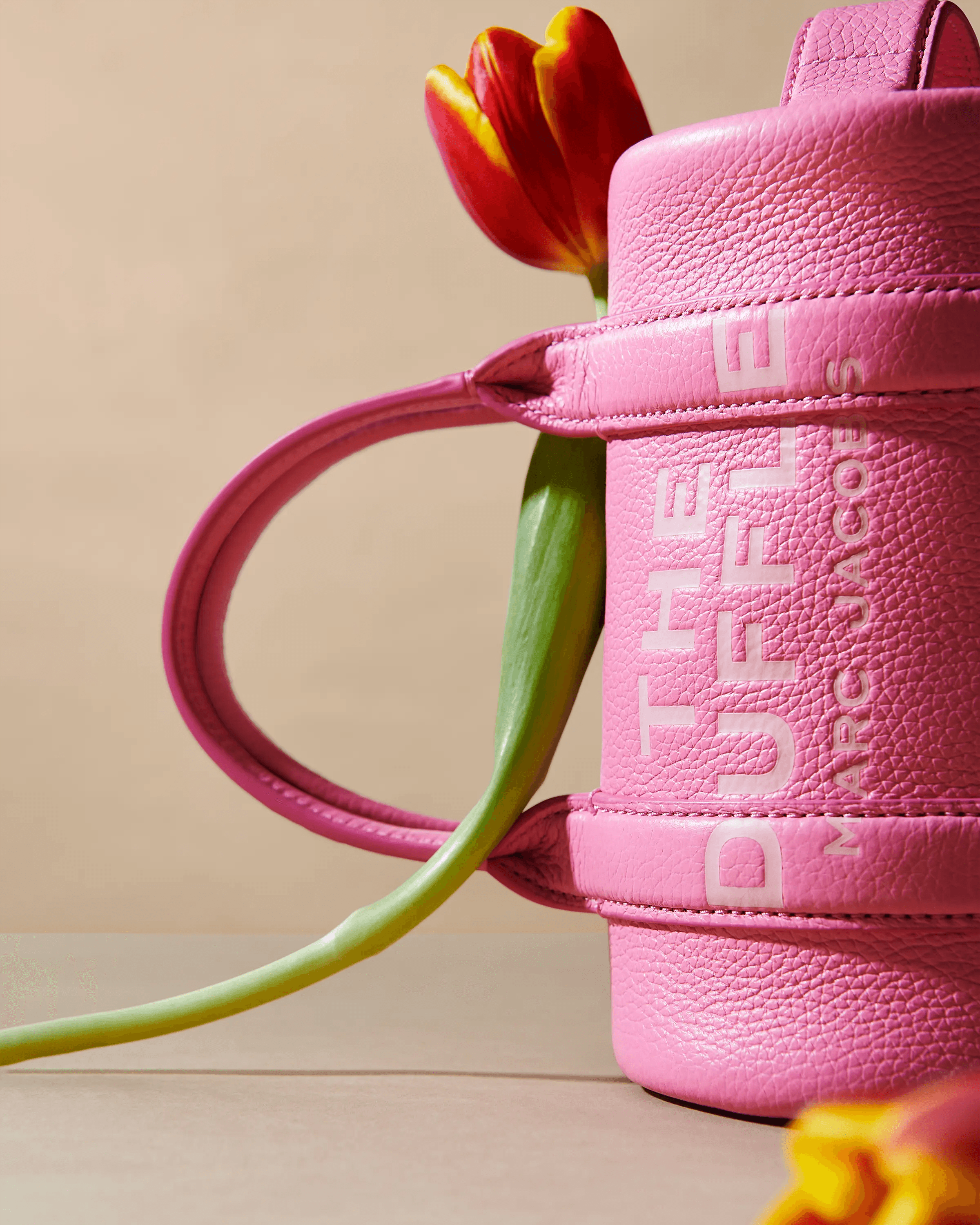 pink Marc Jacobs The Duffle bag with red and yellow tulips, closer composition, luxury accessories still life photography London